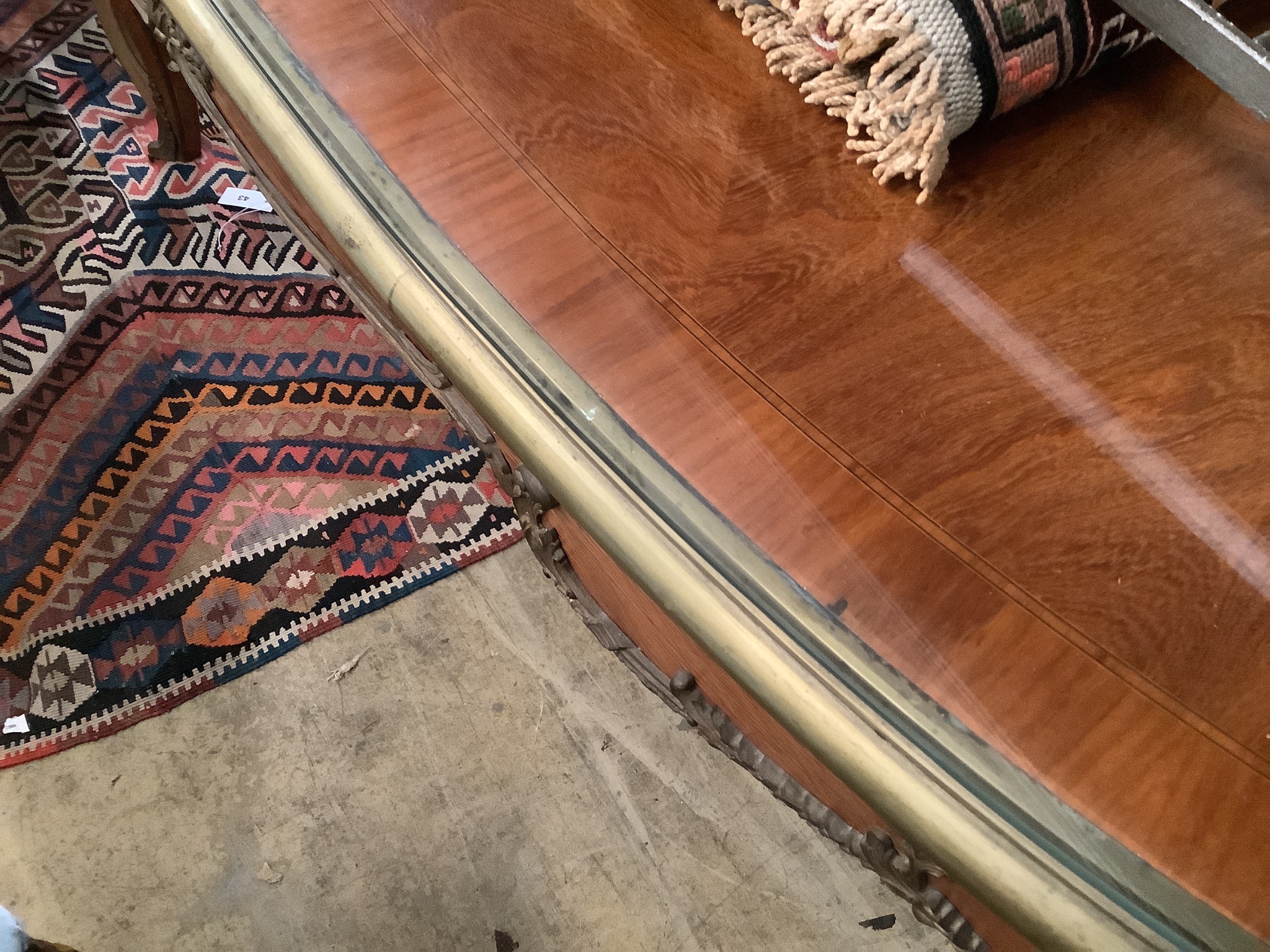 An oval gilt metal mounted Continental dining table, length 200cm, width 100cm, height 78cm